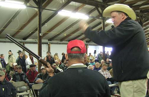 Ken Lindsay of American Eagle Auction & Appraisal Company working the crowd at a gun auction