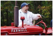 Ken Lindsay selling a McCormick-Deering Farmall tractor at a Michigan public auction.