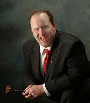 The man behind the gavel, your Michigan Auctioneer Kenny Lindsay, CAI